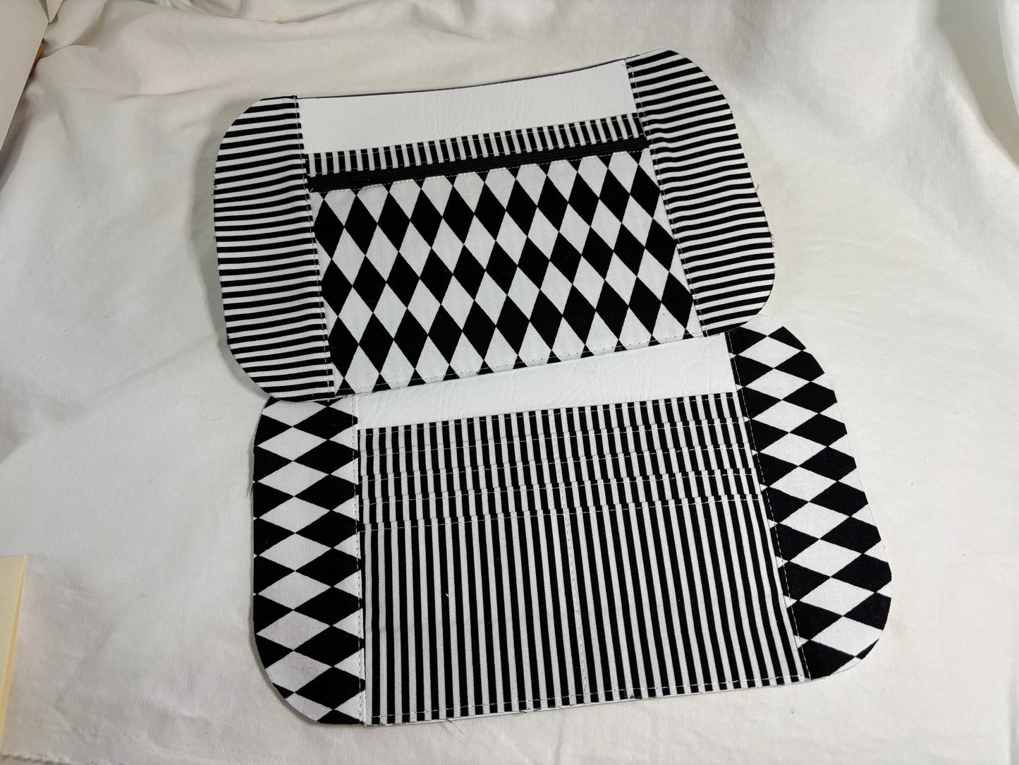 Inside of the purse: 
-top panel: zipper pocket with a slip pocket
- bottom panel: 8 credit cards slots and a slip pocket
